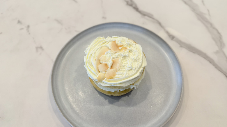 Crumbl and Martha Stewart's Coconut Layer Cake on a plate