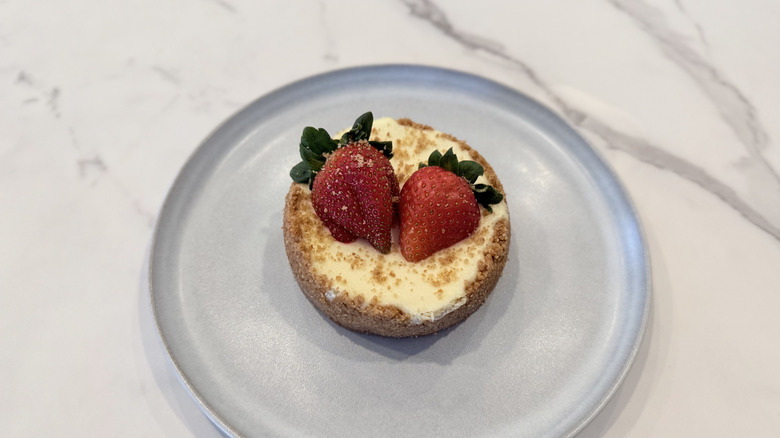 Crumbl and Martha Stewart's New York Cheesecake on a plate