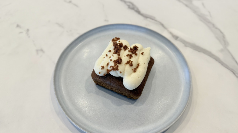 Crumbl and Martha Stewart's Pumpkin Sheet Cake on a plate