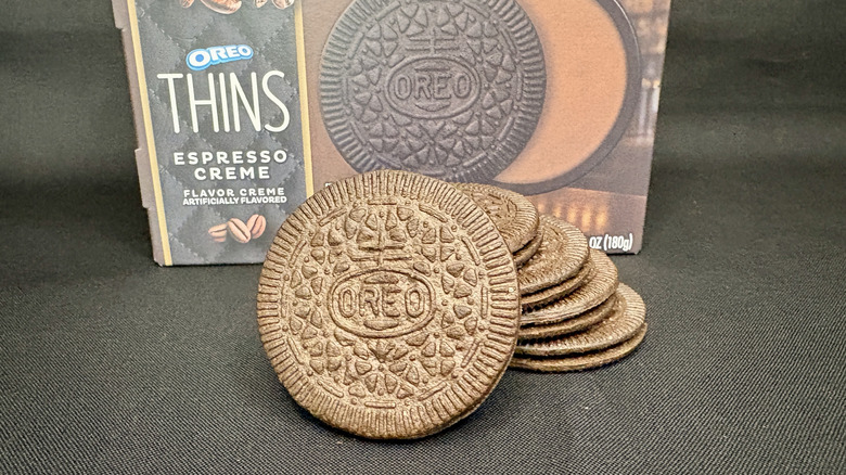 close up of Oreo cookies stacked in front of box