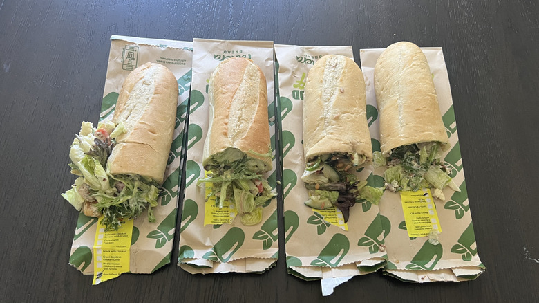 Four types of Panera Salad Stuffers laid out on table.
