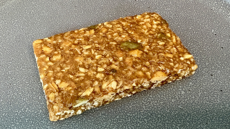 unpackaged granola bar on gray plate
