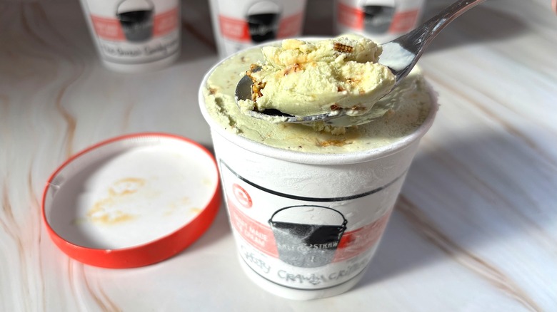 Spoonful of Salt & Straw Creepy Crawly Critters ice cream over pint of ice cream