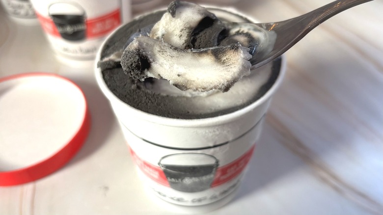 Spoonful of Salt & Straw Essence of Ghost ice cream over pint of ice cream