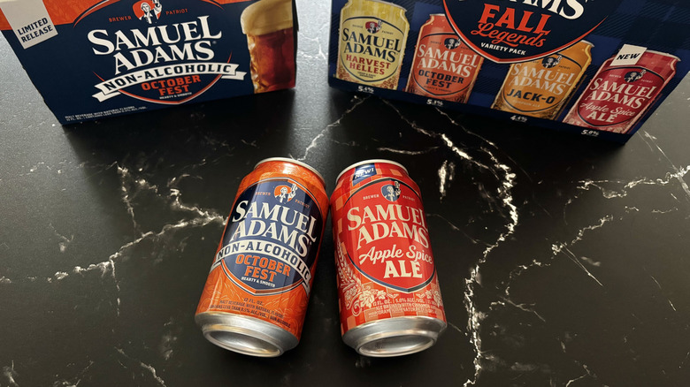 Samuel Adams fall beer cans in front of beer boxes