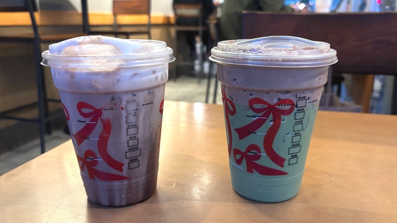 Starbucks Iced Dubai Mocha and Iced Dubai Matcha in plastic cups on wooden table