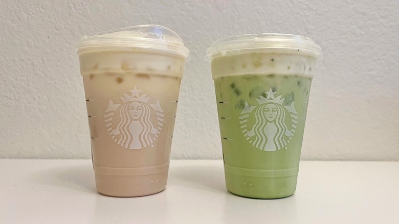 Starbucks Iced Mango Cream Chai and Iced Mango Cream Matcha on a table