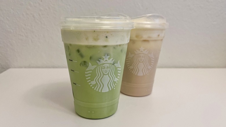 Starbucks Iced Mango Cream Matcha in front of Iced Mango Cream Chai