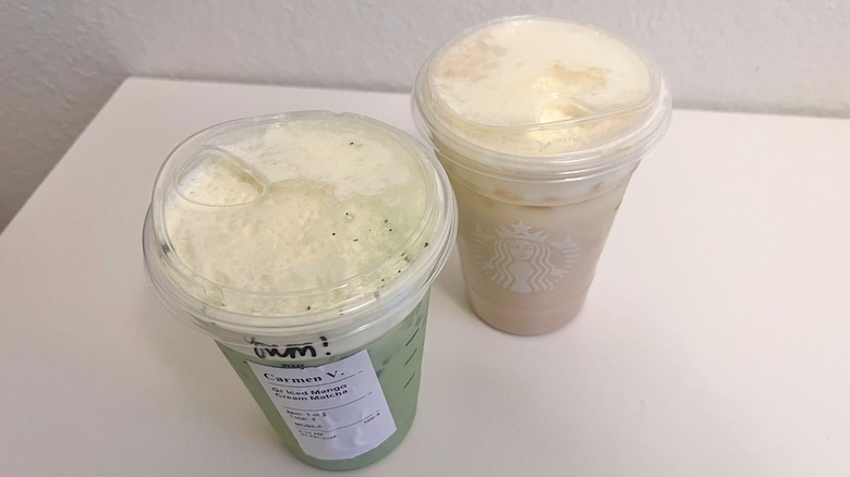 Top view of Starbucks Iced Mango Cream Matcha and Iced Mango Cream Chai