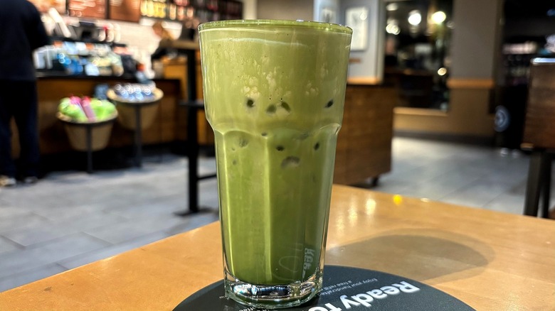 Starbucks Iced Banana Cream Protein Matcha on table in store