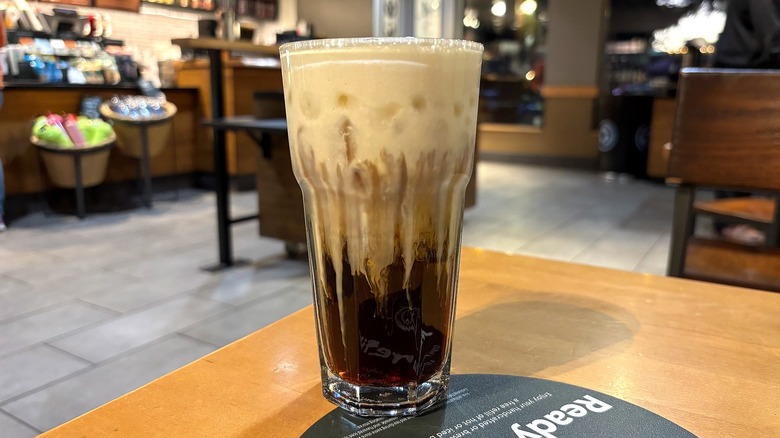 Starbucks Plain Protein Cold Foam on Cold Brew on table in store