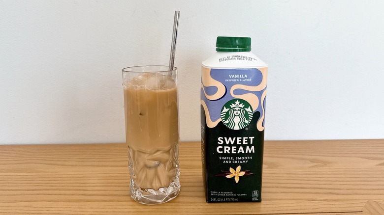 Starbucks Vanilla Inspired Sweet Cream Enhancer bottle and glass of iced coffee