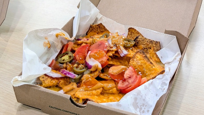 Double cheese Doritos Hot Honey Nachos in a cardboard box lined with wax paper