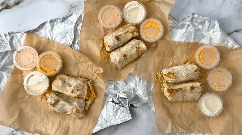Taco Bell Cheesy Dipping Burritos with three sauces