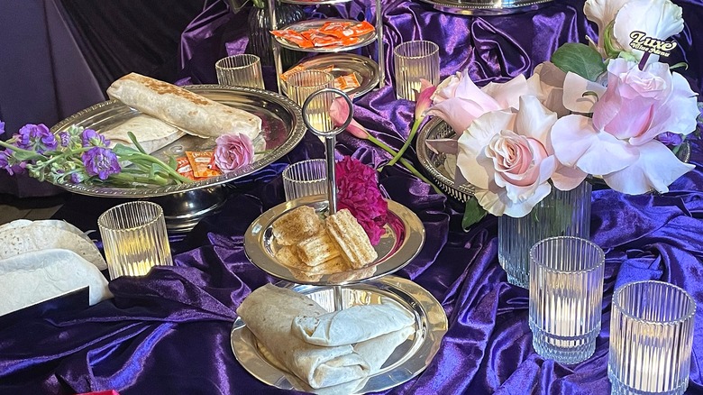 Taco Bell Luxe Value Menu items arranged on various trays and platters