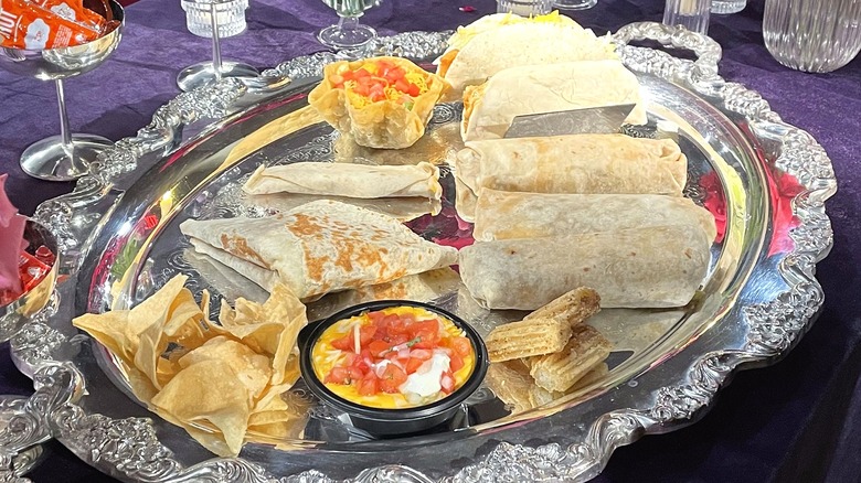 Every item on Taco Bell's Luxe Value Menu, arranged on a silver platter