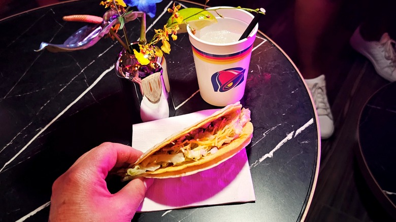 Hand holding Double Decker Taco