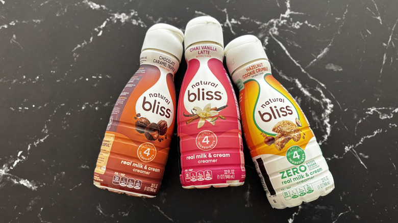 Natural Bliss coffee creamer bottles on countertop