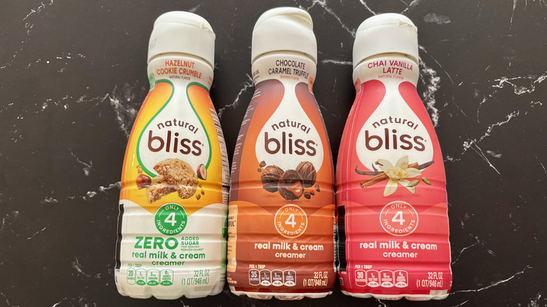 Natural Bliss coffee creamer bottles on countertop