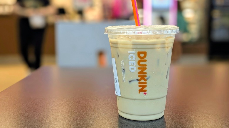 Small Dunkin' Cereal N' Milk Iced Latte on table in store