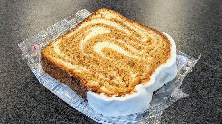 Dunkin' Iced Pumpkin Loaf Cake on table in store