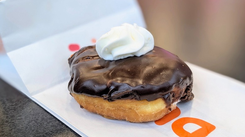 Dunkin' Kreme Delight Donut on table in store