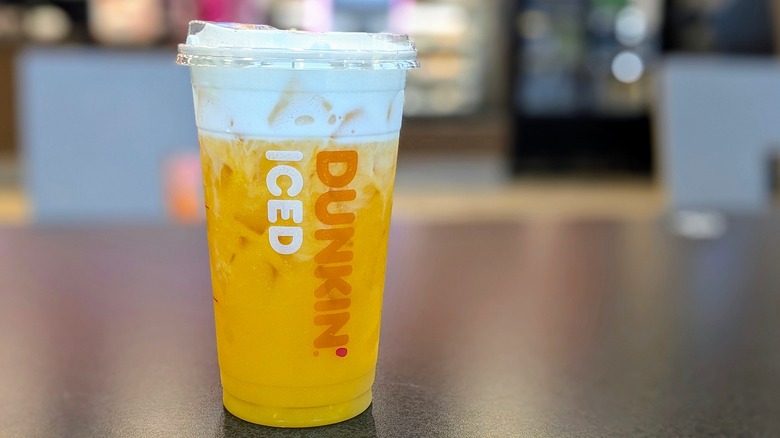Dunkin' Mango Daydream Refresher on table in store