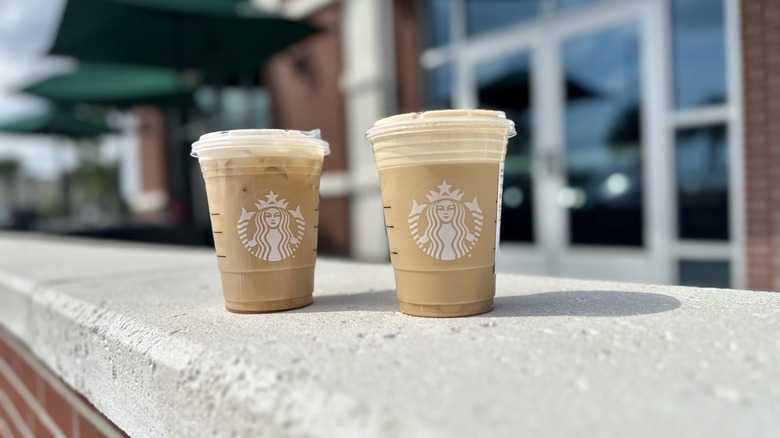 two Starbucks drinks on ledge