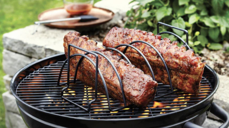 Ribs grilling on a rib rack