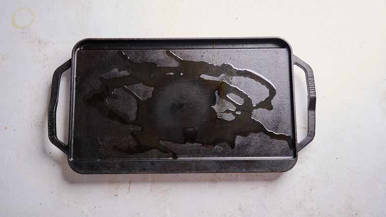 heating oil on a cast iron griddle
