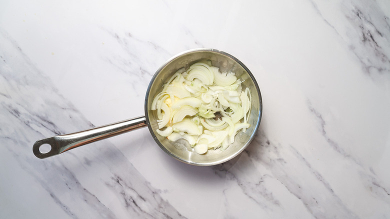 Pan with sliced onions