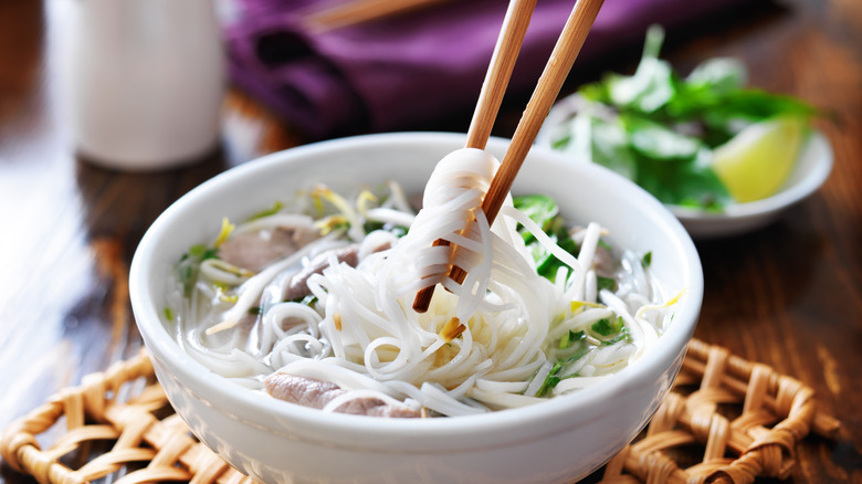 rice noodle dish with chopsticks