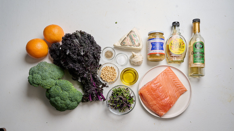 Riced broccoli and salmon salad ingredients on a table