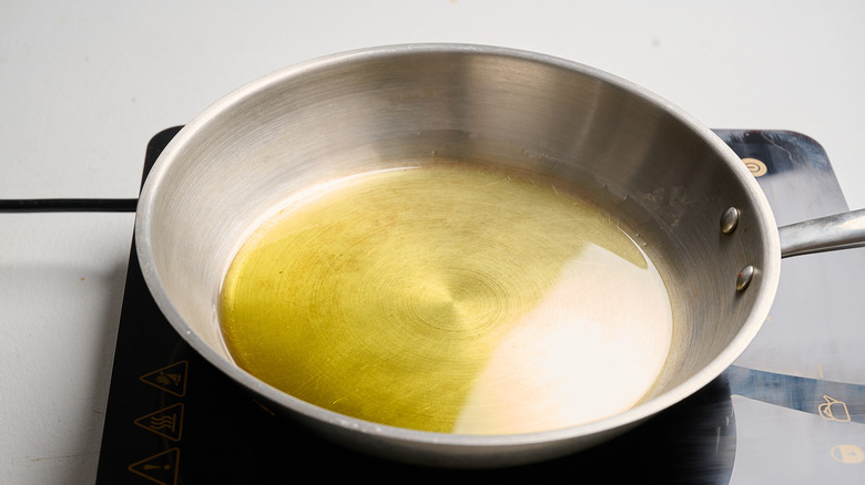 heating oil in a skillet
