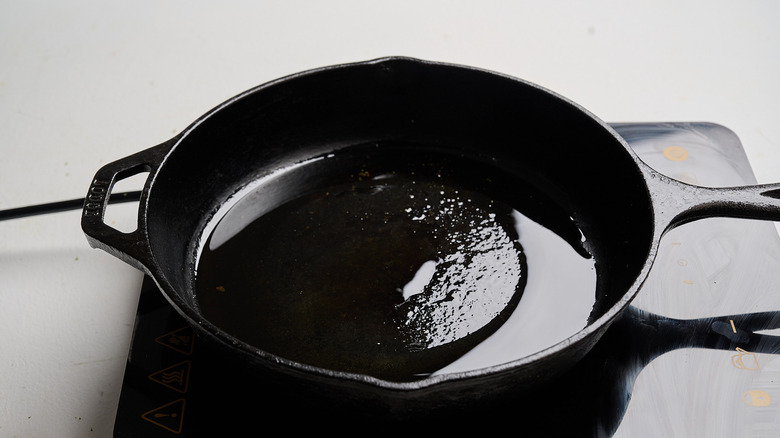 heating oil in a skillet