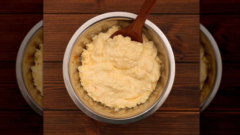 Overhead view of creamy Japanese tartar sauce in a mixing bowl