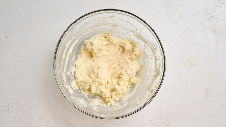 milk mixture and butter combined in a bowl