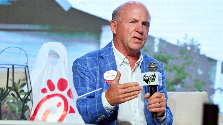Chick-fil-A chairman and former CEO Dan T. Cathy speaks at an event holding a microphone