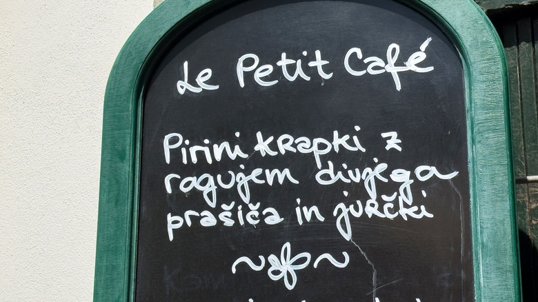 close up of handwritten chalkboard menu at Le Petit Cafe