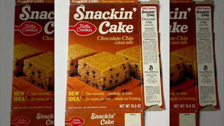old packet of Betty Crocker Snackin' Cake Mix on white background, mirrored image