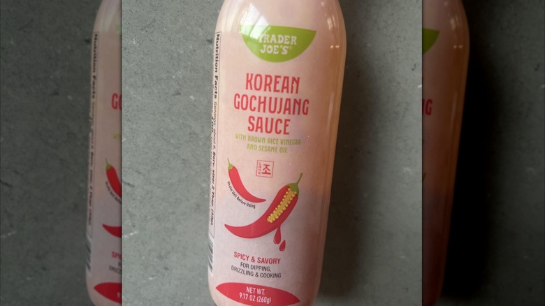 bottle of Trader Joe's Korean gochujang sauce on dark countertop, mirrored image