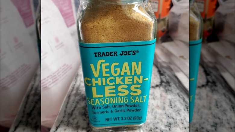 jar of Trader Joe's Vegan Chicken-less Seasoning on kitchen counter, mirrored image