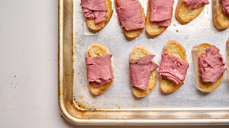 beef rolled onto crostinis
