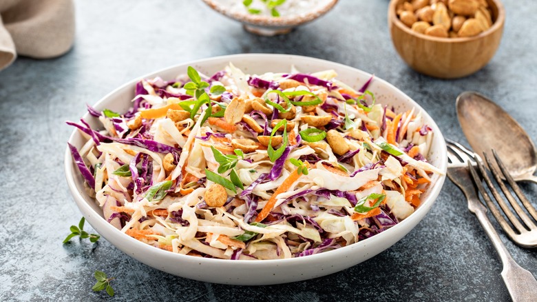  coleslaw in a white bowl with forks