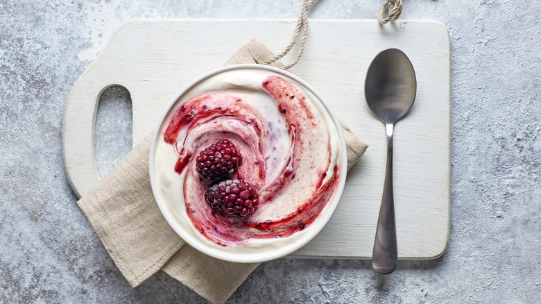 Bowl of yogurt with roasted raspberries 