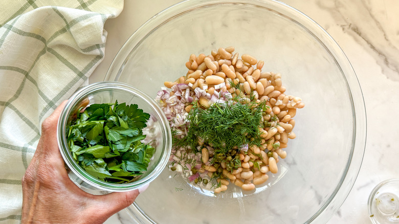 Adding parsley to bowl
