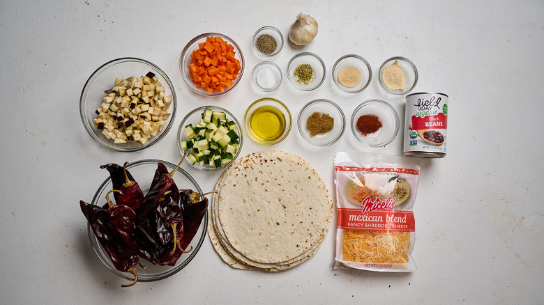 Roasted veggie enchilada ingredients on a table