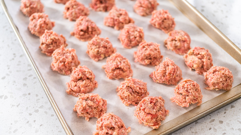 Meatballs on a sheet pan with parchment