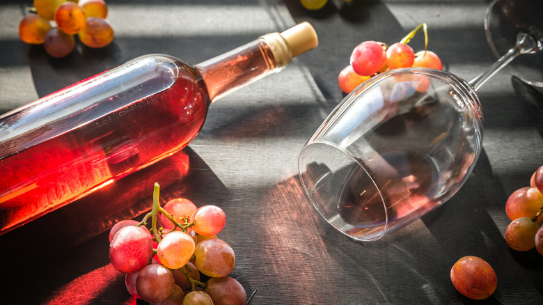 dark rosé wine and grapes