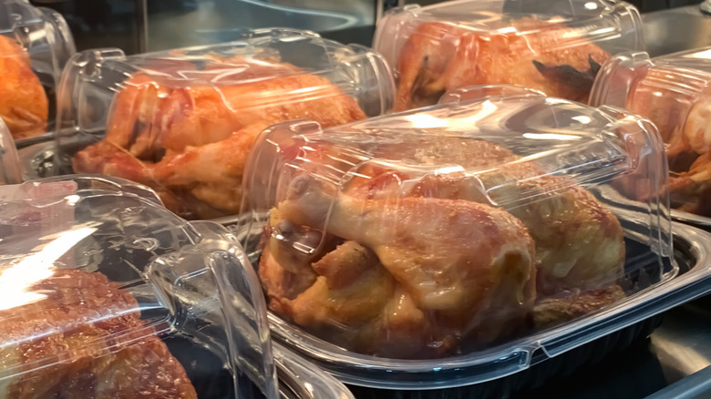 Rotisserie chickens in containers at store